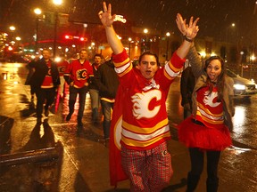 Flames fans celebrate along the Red Mile after a win over Colorado on April 11, 2019.