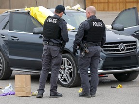 Calgary police investigate after two people were killed in a parking lot at 37th ave. and Barlow Trail N.E. early Wednesday morning in Calgary on Wednesday, April 3, 2019.