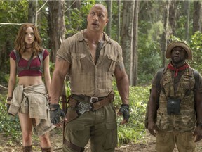 This image released by Sony Pictures shows Karen Gillan, from left, Dwayne Johnson and Kevin Hart in "Jumanji: Welcome to the Jungle." (Frank Masi/Sony Pictures via AP) ORG XMIT: NYET610