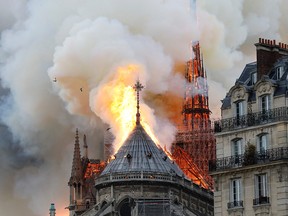 Smoke and flames rise during a fire at the landmark Notre-Dame Cathedral in central Paris on April 15, 2019, potentially involving renovation works being carried out at the site, the fire service said.