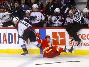 Calgary Flames, James Neal battles Colorado Avalanche, Erik Johnson in first period action of game 1 of the NHL Play-Offs at the Scotiabank Saddledome in Calgary on Thursday, April 11, 2019. Darren Makowichuk/Postmedia