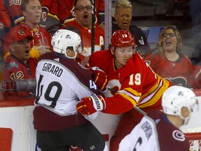 Calgary Flames, Matthew Tkachuk battles Colorado Avalanche, Samuel Girard in first period action of game 1 of the NHL Play-Offs at the Scotiabank Saddledome in Calgary on  Thursday, April 11, 2019.