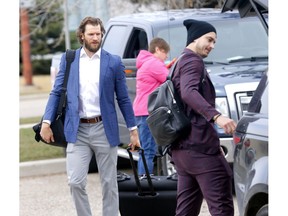 Calgary Flames goalies L-R, Mike Smith and David Rittich head to the bus at the Calgary Airport before heading to game 3 against the Colorado Avalanche for the NHL Play-Offs in Calgary on Sunday, April 14, 2019. Darren Makowichuk/Postmedia