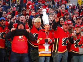Calgary Flames fans brave the weather to take in the Redline Party as the Flames start their Play Off run at the Scotiabank Saddledome in Calgary on Thursday, April 11, 2019. Darren Makowichuk/Postmedia