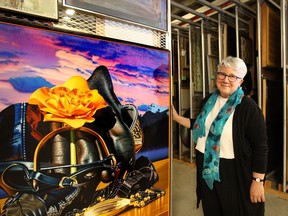 Donna Livingstone President and CEO of the Glenbow Museum poses among the art collection. Wil Andruschak / Calgary Herald.