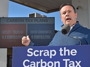 United Conservative Leader Jason Kenney responds to the federal carbon tax, which took effect Monday in some provinces outside Alberta, during a news conference at the Lymburn Esso in west Edmonton on Monday, April 1, 2019.