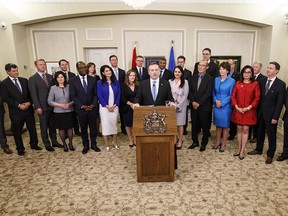 Alberta Premier Jason Kenney, flanked by his cabinet, speaks after being sworn into office in Edmonton on Tuesday, April 30, 2019.