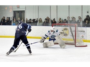 Canmore Eagle Max Giangualano scores on the Calgary Canucks in the second period of their AJHL game at the Banff Fenlands Arena on Wednesday, January 23, 2019. The game was sold out with standing room only in Banff. The Canucks won the game 8-3. photo by Pam Doyle/pamdoylephoto.com