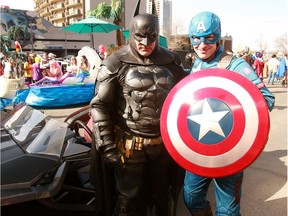 Batman poses for a photo with Captain America during the annual Parade of Wonders that kicks off the 2019 Calgary Comic Expo Friday, April 26, 2019. Dean Pilling/Postmedia