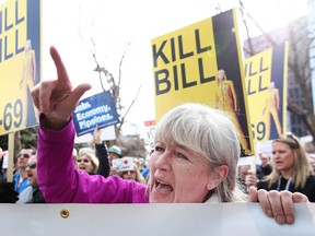 Pro Oil and Pipeline supporters gather outside the Sheraton Eau Claire in Calgary on Tuesday, April 9, 2019. About 300 people gathered at a rally opposing Bill C-48 during a Senate committee hearing at the hotel.