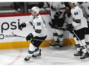 San Jose Sharks centre Logan Couture celebrates after scoring an empty-net goal against the Colorado Avalanche during the third period of Game 3 of an NHL hockey second-round playoff series Tuesday in Denver. The Sharks won 4-2.