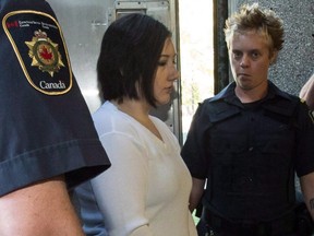 Terri-Lynne McClintic, convicted in the death of 8-year-old Woodstock, Ont., girl Victoria Stafford, is escorted into court in Kitchener, Ont., on Wednesday, September 12, 2012 for her trial in an assault on another inmate while in prison.