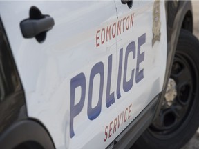 Edmonton Police guard the scene of a suspicious death in the Kildare neighbourhood of north Edmonton on April 24, 2018. One day prior a 25 year-old woman was injured at the home and later died.  Photo by Shaughn Butts / Postmedia .... Stock photo, stk, police car