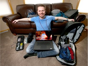 Corey van der Laan is surrounded all the items he took on a year-long trip around the world. Jim Wells/Postmedia