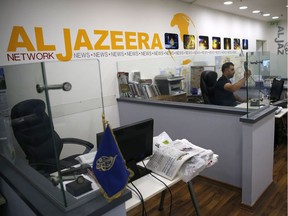 An employee of the Qatar based news network and TV channel Al-Jazeera is seen at the channel's Jerusalem office on July 31, 2017. Israel said on August 6, 2017 that it planned to close the offices of Al-Jazeera after Prime Minister Benjamin Netanyahu accused the Arab satellite news broadcaster of incitement. A statement from the communications ministry said it would demand the revocation of the credentials of journalists working for the channel and also cut its cable and satellite connections.