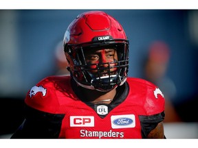 Jamar Wall of the Calgary Stampeders runs onto the field during player introductions before facing the Saskatchewan Roughriders in CFL football on Saturday, July 22, 2017. Al Charest/Postmedia