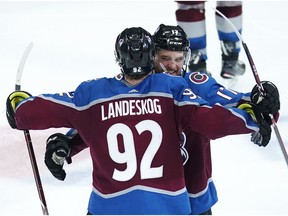 Colorado Avalanche left wing Gabriel Landeskog hugs teammate Tyson Jost  after scoring the overtime goal against the San Jose Sharks in Game 6 of an NHL hockey second-round playoff series Monday night in Denver. Colorado won 4-3 in overtime.