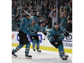 San Jose Sharks' Evander Kane, left, and Joonas Donskoi celebrate a goal by Tomas Hertl (48) during the third period of Game 5 of the team's NHL hockey second-round playoff series against the Colorado Avalanche on Saturday, May 4, 2019, in San Jose, Calif.