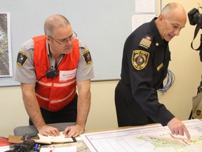 Banff Fire Chief Silvio Adamo, right, takes part in wildfire readiness exercise on Wednesday. Marie Conboy/Postmedia News