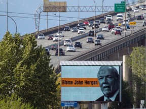 Motorists travel over the Alex Fraser Bridge as an electronic billboard paid for by the B.C. Liberal caucus, placing blame for high gas prices on Premier John Horgan is seen in Delta, B.C., on Saturday May 4, 2019.