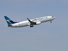 A WestJet 737-800 aircraft takes off from Calgary International Airport on Monday May 13, 2019.