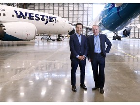 Tawfiq Popatia, a managing director at Onex, left, stands with WestJet President and CEO Ed Sims next to Boeing 737 and 787 Dreamliner aircraft in one of WestJet's Calgary hangers on Monday May 13, 2019. Onex announced it was buying WestJet for $5 Billion earlier this year.