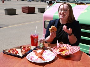 Calgary Herald reporter Stephanie Babych samples some of the 50 new foods that will be on offer at the Calgary Stampede this year. The Calgary Stampede previewed some of the food during noon hour on Wednesday May 15, 2019. Gavin Young/Postmedia