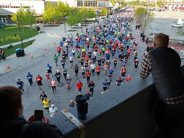 Runners in the Calgary Scotiabank Marathon and Half Marathon race off the start at Stampede Park on Sunday May 26, 2019.