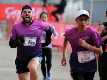 Jugo Juice 10K runners dig deep as they race for the line during the Scotiabank Calgary Marathon at Stampede Park on Sunday May 26, 2019.