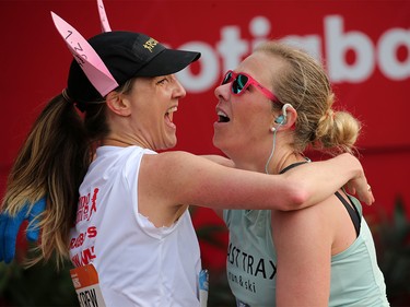 Pace bunny Polly Moody, left congratulates Jessica Jurcic after they crossed the finish line in the Centaur Subaru Half Marathon in Calgary on Sunday May 26, 2019.