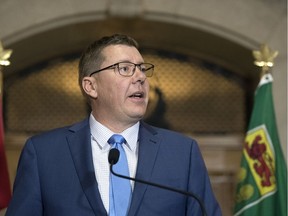 Premier Scott Moe  responds to reporters after losing a Saskatchewan Court of Appeal's decision May 3 on the carbon tax in the Legislative Building in Regina.