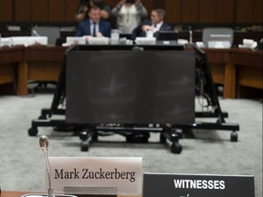 An empty chair sits behind the name plate for Facebook's Mark Zuckerberg as the International Grand Committee on Big Data, Privacy and Democracy waits to begin in Ottawa, Tuesday May 28, 2019. Zuckerberg did not appear before the committee.