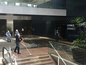 City hall is mopping up after sheets of water began pouring from the overhead sprinkler system Thursday night while construction was underway on the building.