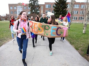 Students at Western Canada High School in downtown Calgary walk out of class during a GSA show of support on Friday, May 3, 2019.