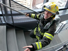 Firefighters reach the halfway point during The Firefighter Stairclimb Challenge at the Bow building in downtown Calgary on Sunday, May 5, 2019. Over 400 participants climbed the 57 floors of the building to raise funds for Wellspring. Jim Wells/Postmedia