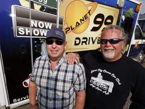 Wes Shaw, left, and Jeff Langford with the old ambulance the River City Classics Car Club is using to house a movie projector for a drive-in.