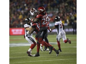 Calgary Stampeders Don Jackson (25) catches the ball and then runs it for a touchdown against the Ottawa Redblacks during the 106th Grey Cup game on Sunday, Nov. 25, 2018, in Edmonton.