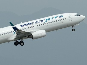 A WestJet plane takes off from Vancouver International Airport in Vancouver.