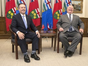 Ontario Premier Doug Ford poses with Alberta Premier Jason Kenney at the Ontario Legislature in Toronto on Friday, May 3, 2019.