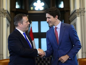 Prime Minister Justin Trudeau shakes hands with Alberta Premier Jason Kenney in his office on Parliament Hill in Ottawa on Thursday, May 2, 2019.