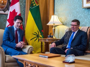 Prime Minister Justin Trudeau meets with Premier Scott Moe in the Premier's Office at the legislative building in Regina in March 2018.