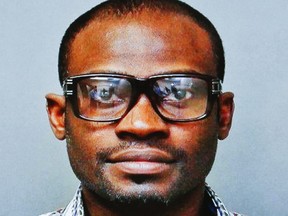 An image of a the accused is displayed on a screen during a press conference at Toronto Police Headquarters in downtown Toronto, Ont. Monday April 15, 2013.