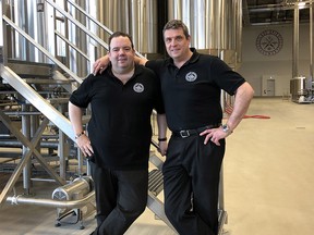 Anthony Van Hecke, general manager, left, and Andreas Althof, head brewmaster, of Last Spike Brewery in Calgary. For David Parker column, May 16, 2019.