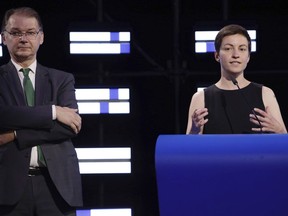 Co-Presidents of the Greens/EFA Group, Philippe Lamberts, left, and Ska Keller, right, speak in the hemicycle of the European Parliament in Brussels, Sunday, May 26, 2019. From Germany and France to Cyprus and Estonia, voters from 21 nations went to the polls Sunday in the final day of a crucial European Parliament election that could see major gains by the far-right, nationalist and populist movements that are on the rise across much of the continent.