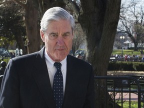 FILE - In this March 24, 2019 photo, Special Counsel Robert Mueller walks past the White House, after attending St. John's Episcopal Church for morning services, in Washington.