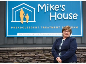 Executive director of Hull Services Julie Kerr poses for a portrait in front of Mike's House. The new space opening on Wednesday is aimed at enhance the Preadolescent Treatment Program.