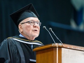 Don Braid, longtime Calgary Herald columnist on politics and government, addresses Mount Royal University graduates after receiving an honorary doctor of laws degree on Friday, June 7, 2019.