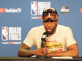 Still wearing goggles to protect his eyes from Champagne showers, Kawhi Leonard speaks with the media following the Toronto Raptors' victory over the Golden State Warriors in Game Six of the 2019 NBA Finals on June 13, 2019 in Oakland, California.