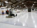 A rink attendant clears the ice at the West Hillhurst Community Association in this file photo.