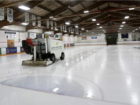 A rink attendant cleans the ice at the West Hillhurst Community Association in this file photo.